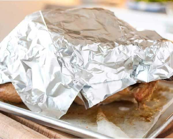 step 1 of carving a turkey, turkey covered in foil