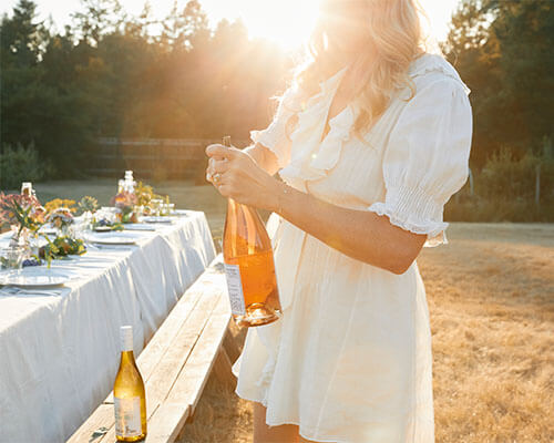 opening wine for outdoor gathering