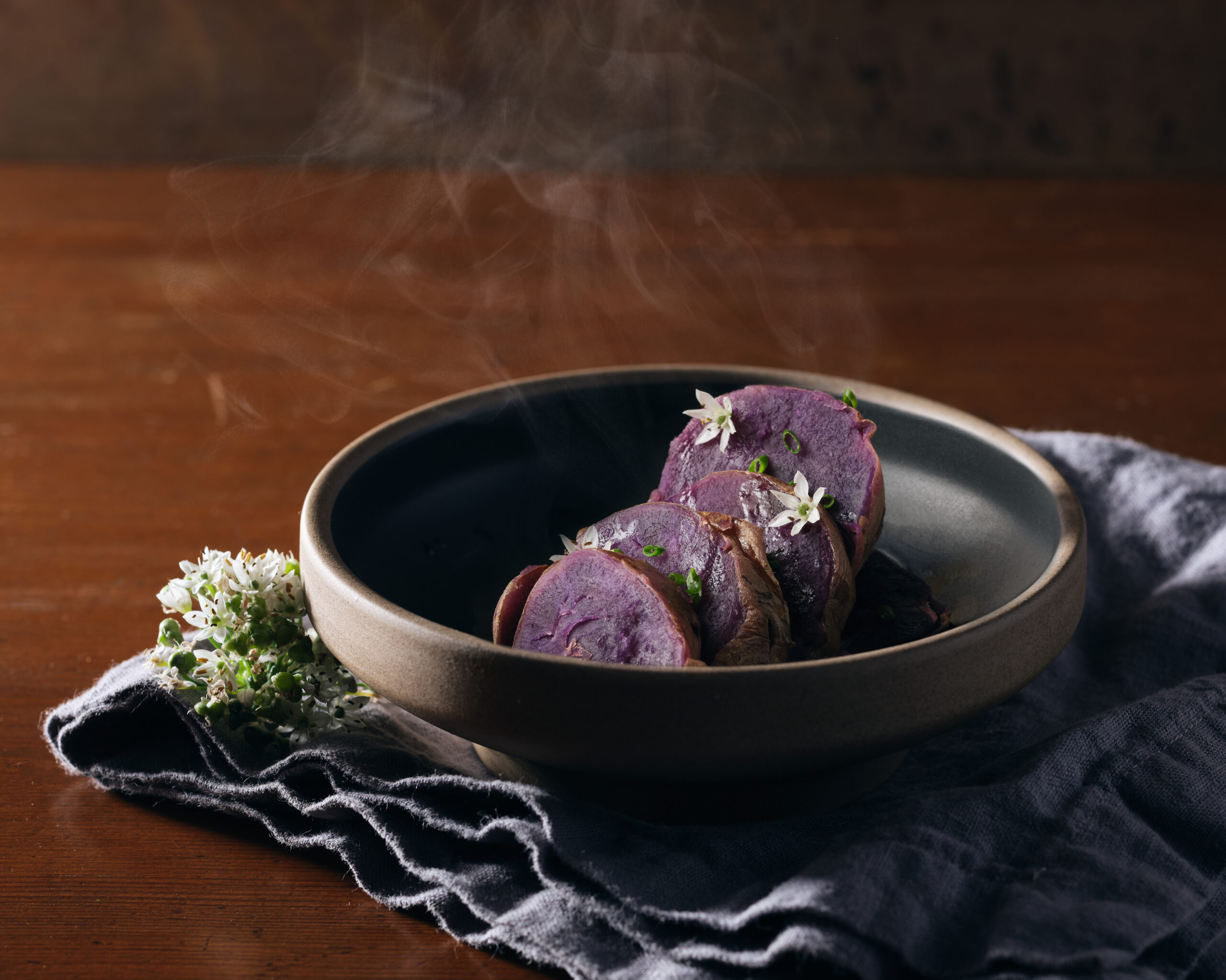 okinawan sweet potato sliced and cooked steaming in a bowl